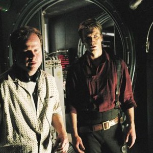 SERENITY, director Joss Whedon, Nathan Fillion, on set, 2005. ©Universal