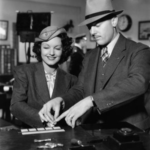 SHE HAD TO EAT, Rochelle Hudson, being fingerprinted by Los Angeles Police fingerprint expert H.M. Stahl, in preparation for her role, 1937, ©20th Century Fox Film Corp. All rights reserved