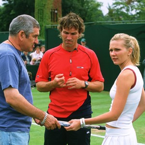 (L to r) Director RICHARD LONCRAINE, Wimbledon champion and tennis consultant PAT CASH and KIRSTEN DUNST (as Lizzie Bradbury) on the set of Working Title Films' romantic comedy Wimbledon. photo 18