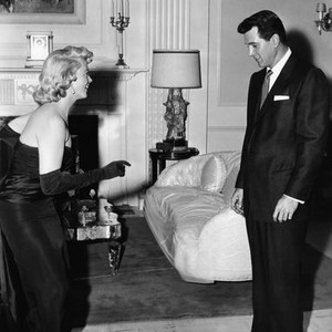 WRITTEN ON THE WIND, Dorothy Malone, left, teaches Rock Hudson a new dance step, on-set, 1956
