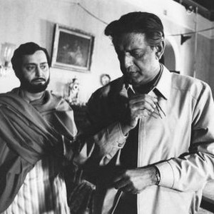THE HOME AND THE WORLD, (aka GHARE-BAIRE), from left: Soumitra Chatterjee, writer/director Satyajit Ray, on set, 1984. ©European Classics Video