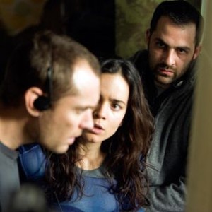 REPO MEN, from left: Jude Law, Alice Braga, director Miguel Sapochnik, on set, 2010. ph: Kerry Hayes/©Universal Pictures