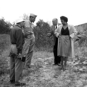 CARMEN JONES, Director Otto Preminger (center) directs Harry Belafonte and Dorothy Dandridge on their fight scene, 1954. TM and Copyright (c) 20th Century Fox Film Corp. All rights reserved..