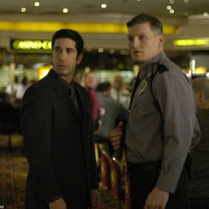 David Schwimmer(l) in the title role and Chance Kelly as Tommy, a security guard, in a scene from DUANE HOPWOOD