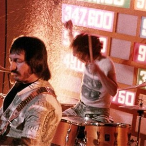 TOMMY, The Who, John Entwistle, Keith Moon, are performing the song, "Pinball Wizard," 1975.