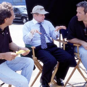 Producer Robert Simonds (center) discusses a scene with director Rob Pritts (right) and co-producer Ira Shuman (left) on the set of Touchstone Pictures' hilarious comedy, "Corky Romano." photo 16