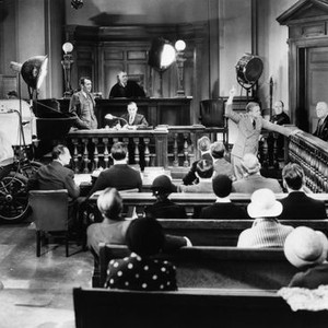 THE NUISANCE, director Jack Conway (hands in pockets) filming Lee Tracy addressing the jury on set, 1933