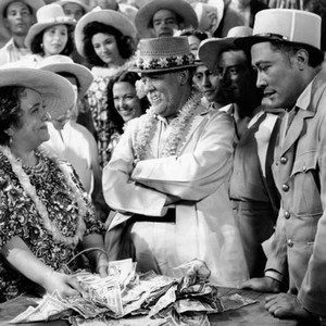 THE TUTTLES OF TAHITI, wearing leis from left: Florence Bates, Charles Laughton, 1942