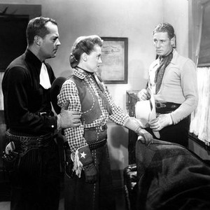 LAW OF THE SADDLE, from left: Robert 'Bob' Livingston, Betty Miles, 1943