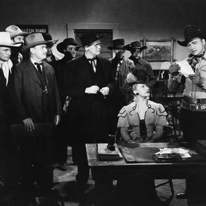 THE WHISPERING SKULL, second, third, fourth, sixth, seventh, ninth and eleventh from left: Dave O'Brien, Guy Wilkerson, Ed Cassidy, I Stanford Jolley, Henry Hall, Denny Burke, Tex Ritter, 1944
