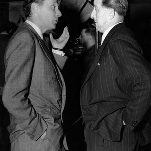 ODD MAN OUT, director Carol Reed, talks to producer J. Arthur Rank, on-set, 1947