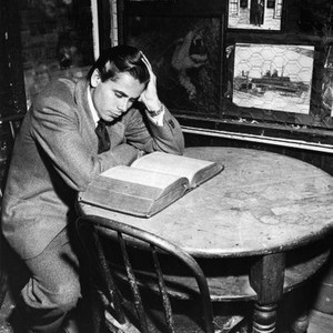 THE ADVENTURES OF MARTIN EDEN, Glenn Ford, studying source author Jack London's dictionary, 1942