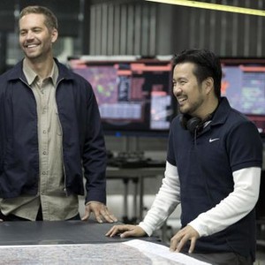 FAST & FURIOUS 6, from left: Paul Walker, director Justin Lin, on set, 2013. ph: Giles Keyte/©Universal Pictures
