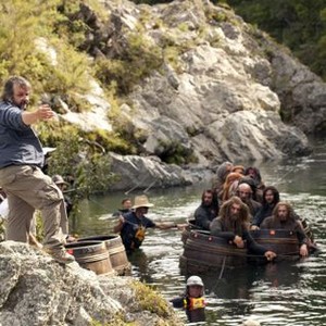 THE HOBBIT: THE DESOLATION OF SMAUG, front: director Peter Jackson, in barrels, front, from left: Jed Brophy, Dean O'Gorman, second row, from left: Richard Armitage, Graham McTavish, Aidan Turner, on set, 2013. ph: James Fisher/©Warner Bros. Pictures