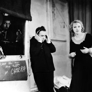 BLACKMAIL, director Alfred Hitchcock (center), Anny Ondra, on set, 1929