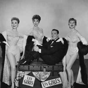 LES GIRLS, Gene Kelly (seated), standing from left: Mitzi Gaynor, Kay Kendall, Taina Elg, 1957