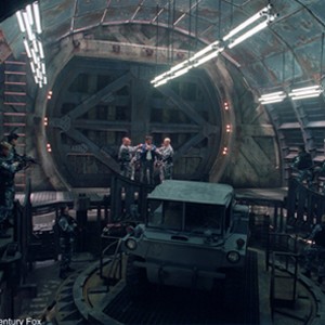 Wolverine (Hugh Jackman, center) is held captive in a massive underground base.