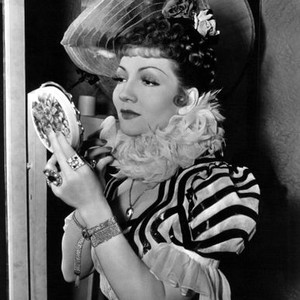 ZAZA, Claudette Colbert, 1939, checking her makeup in compact
