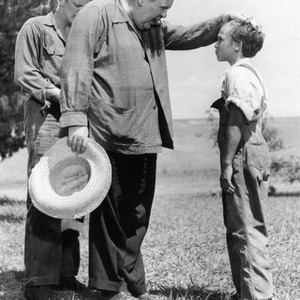 THE NIGHT OF THE HUNTER, Charles Laughton directs Billy Chapin, Peter Graves (l )watches, on location, 1955