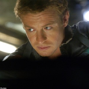 SIMON BAKER stars as Riley, one of a group of mercenaries hired to keep the city of the living in supplies.