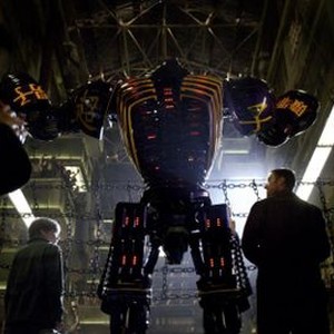 "REAL STEEL"  FF-005  Down-on-his-luck fight promoter Charlie Kenton (Hugh Jackman, right) and his son, Max (Dakota Goyo, left) introduce their star robot boxer Noisy Boy to the cheering crowd at the Crash Palace in DreamWorks Pictures' action drama "Real