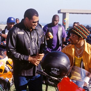 The leader of the Black Knights, Smoke (LAURENCE FISHBURNE, left) takes a moment between races with Soul Train (ORLANDO JONES) another member of his club in DreamWorks Pictures' actioner BIKER BOYZ. photo 17