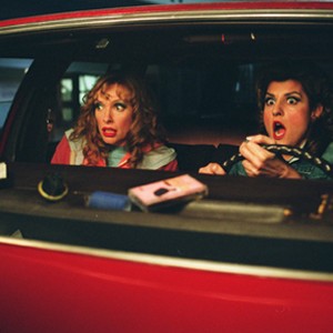 Carla (TONI COLLETTE) and Connie (NIA VARDALOS, driving) fear they've been tracked to their new home in the new comedy, Connie and Carla. photo 20