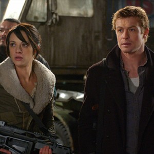 Mercenaries Riley (SIMON BAKER, right) and Slack (ASIA ARGENTO, left) are deployed by the leaders of a walled city.