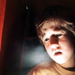 Frightened by his paranormal powers, 8-year-old Cole Sear (Haley Joel Osment) is too young to understand his purpose.