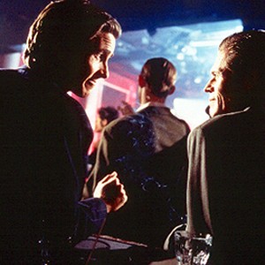(L-R) Christian Bale as Patrick Bateman and Willem Dafoe as Det. Donald Kimball in "American Psycho."