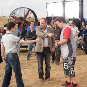 HARRY POTTER AND THE ORDER OF THE PHOENIX, front, from left: Daniel Radcliffe, director David Yates, Harry Melling, on set, 2007. ©Warner Bros.