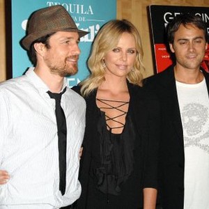 Martin Henderson, Charlize Theron (wearing a Givenchy dress), Stuart Townsend at arrivals for Premiere BATTLE IN SEATTLE, Beverly Hills, Los Angeles, CA, September 22, 2008. Photo by: Dee Cercone/Everett Collection