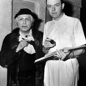 KING OF ALCATRAZ, from left: J. Carrol Naish dressed in old lady disguise, with director Robert Florey, going over script, 1938