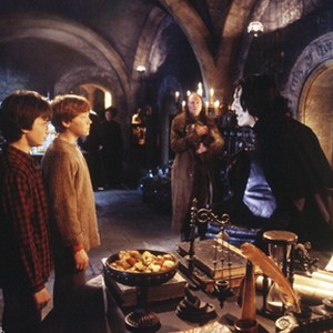 (L-r) Harry (DANIEL RADCLIFFE), Ron (RUPERT GRINT), Filch (DAVID BRADLEY) and Professor Snape (ALAN RICKMAN) in Warner Bros. Pictures' "Harry Potter and the Chamber of Secrets."