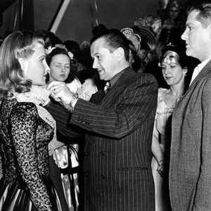 FLESH AND FANTASY, Betty Field, Director Julien Duvivier, and Robert Cummings on set, 1943