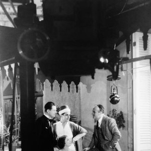 THE BARBARIAN, from left: Reginald Denny, Ramon Novarro, Myrna Loy (seated), director Sam Wood on set, 1933