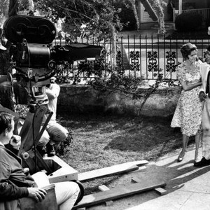 TOYS IN THE ATTIC, director George Roy Hill (seated left), Geraldine Page, Dean Martin filming a scene on set, 1963