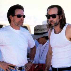 CON AIR, Producer Jerry Bruckheimer, Nicolas Cage on the set, 1997