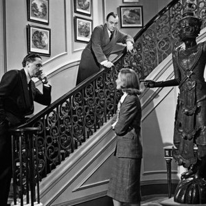 THE FALLEN IDOL, on staircase from left: director Carol Reed, Ralph Richardson, Michele Morgan (at statue) on set, 1948