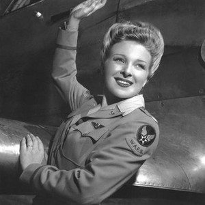 LADIES COURAGEOUS, Evelyn Ankers, in a Women's Auxiliary Ferrying Squadron (WAFS) uniform, 1944
