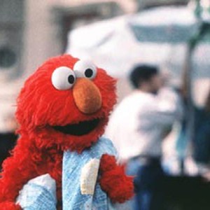 With his cherished blue blanket at his side, 'Sesame Street's' lovable red monster, Elmo, makes his feature film debut.