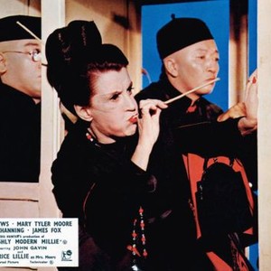 THOROUGHLY MODERN MILLIE, Beatrice Lillie (blowing), Jack Soo (right), 1967