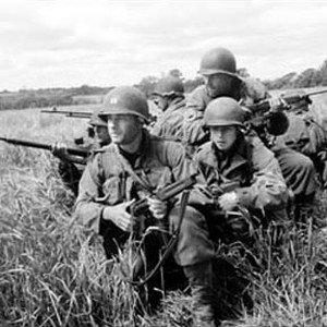 Captain John Miller (HANKS, foreground) leads a squad of soldiers, including Medic Wade (RIBISI) and Sergeant Horvath (SIZEMORE), on a mission behind enemy lines to find one man: Private James Ryan. photo 2