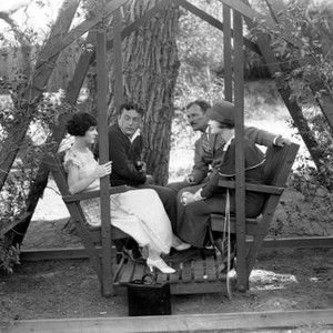 THE MAD WHIRL, May McAvoy, screenwriter Lewis Milestone, director William A. Seiter and his wife Laura La Plante on set, 1925