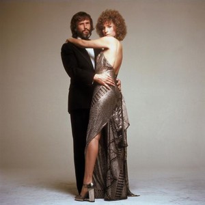 A STAR IS BORN, Kris Kristofferson, Barbra Streisand (wearing a gown she designed for the film), 1976