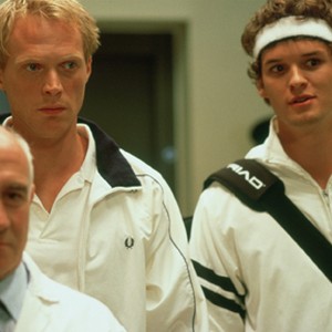 (L to r) British contender Peter Colt (PAUL BETTANY) and American champ Jake Hammond (AUSTIN NICHOLS) are led to the famed Centre Court in Working Title Films' romantic comedy Wimbledon. photo 8