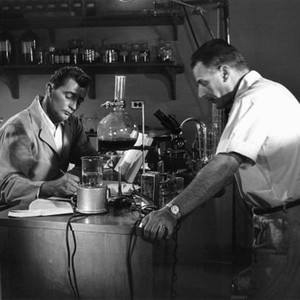 NOT AS A STRANGER, Robert Mitchum, director Stanley Kramer on set, 1955