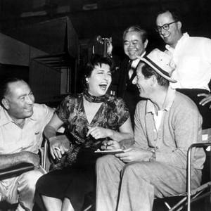 THE ROSE TATTOO, Danny Kaye (seated right) visits producer Hal Wallis, Anna Magnani, cinematographer James Wong Howe, director Daniel Mann on set, 1955