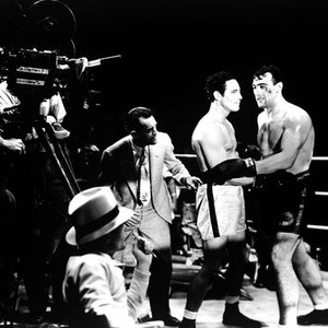 THE PRIZEFIGHTER AND THE LADY, director W.S. Van Dyke (crouching in ring), Max Baer, Primo Carnera rehearsing a scene on set, 1933