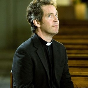 Tom Hollander as Rev Adam Smallbone